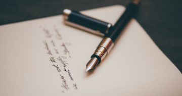 Handwritten letter with pen