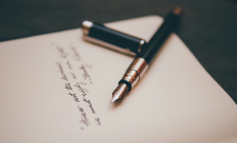 Handwritten letter with pen