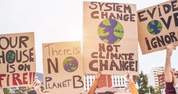 Group of demonstrators on road, young people from different culture and race fight for climate change - Global warming and enviroment concept