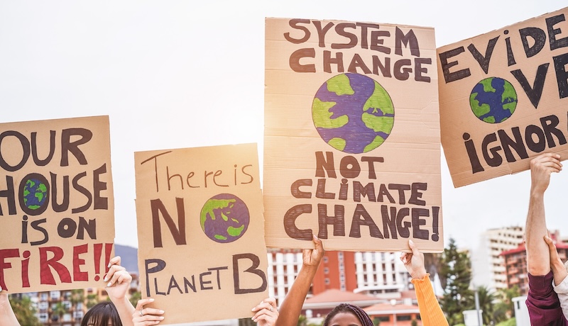 Group of demonstrators on road, young people from different culture and race fight for climate change - Global warming and enviroment concept 