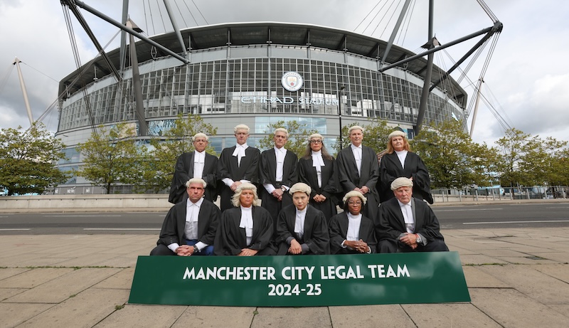 barrister's line up outside Manchester City's stadium