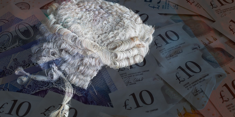 Barristers wig and money