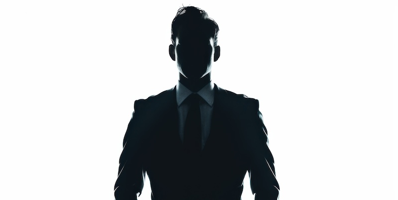 Mysterious silhouette of a business person in the background